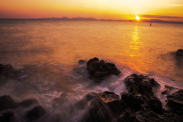sunset over the sea , long exposure techniques