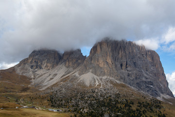 Langkofel in the Dolomites. Peak covered in Clouds. Massive Mountains located in South Tyrol. Famous and loved Tourist destination in the Alps