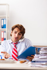 Man having meal at work during break