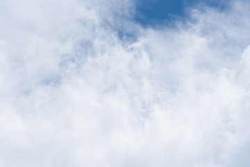 Wispy white clouds against a blue sky as a nature background