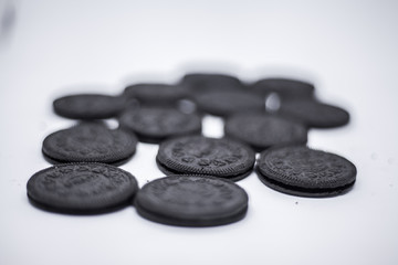 black biscuits on white background 