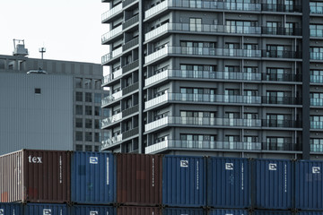It is a group of containers lined with the blue sky and the port