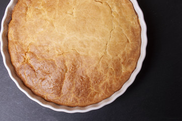 Tasty fresh homemade pie on black background