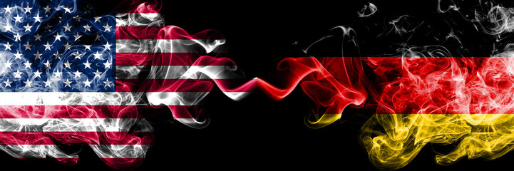 United States of America vs Germany, German smoky mystic flags placed side by side. Thick colored...