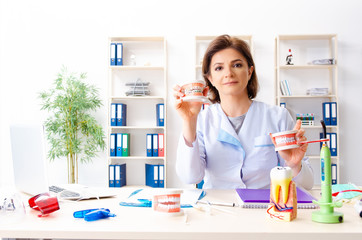Female doctor working on new teeth implant 