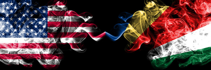 United States of America vs Seychelles, Seychelloise smoky mystic flags placed side by side. Thick colored silky smoke flags of America and Seychelles, Seychelloise