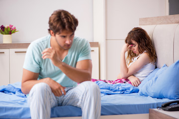 Fototapeta premium Young couple in the bedroom 