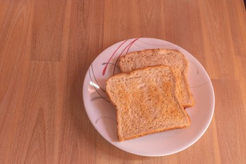 Two slices of bread on a plate