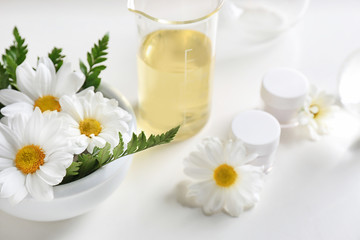 Skin care products, ingredients and laboratory glassware on white background. Dermatology research