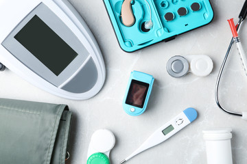 Flat lay composition with medical objects on grey background