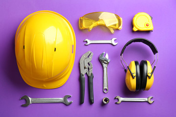 Flat lay composition with different construction tools on color background