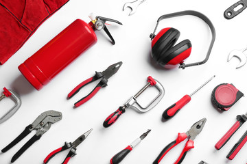 Set of different construction tools on white background, top view