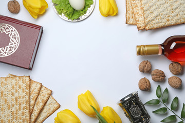 Fototapeta na wymiar Flat lay composition with symbolic Passover (Pesach) items on white background, space for text