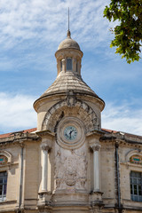 Fototapeta na wymiar Clock tower of Lycee Alphonse-Daudet in Nimes, France