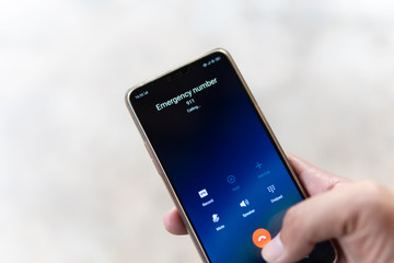 Emergency and urgency, dialing 911 on smartphone screen. Shallow depth of field.