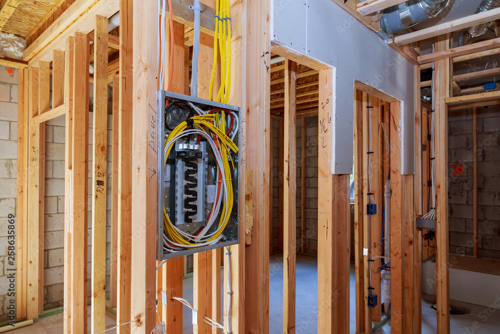 Wall mural interior wood framing of house under construction power supply for the house