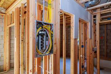 Interior wood framing of house under construction power supply for the house