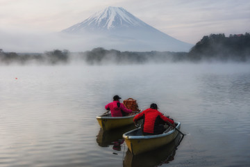 Fishermen at lake Shoji and mount Fuji