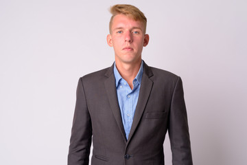 Portrait of young blonde businessman with suit