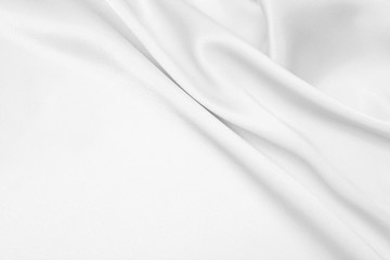The texture of the satin fabric of white color for the background 