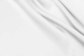 Fototapeta na wymiar The texture of the satin fabric of white color for the background 