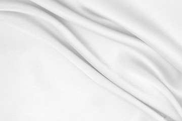 The texture of the satin fabric of white color for the background 