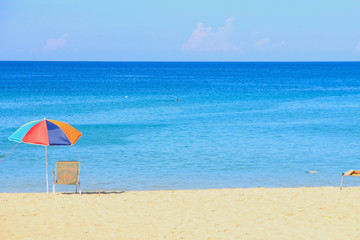 Colorful Parasol and White Bench on Karon Beach, Phuket, Thailand