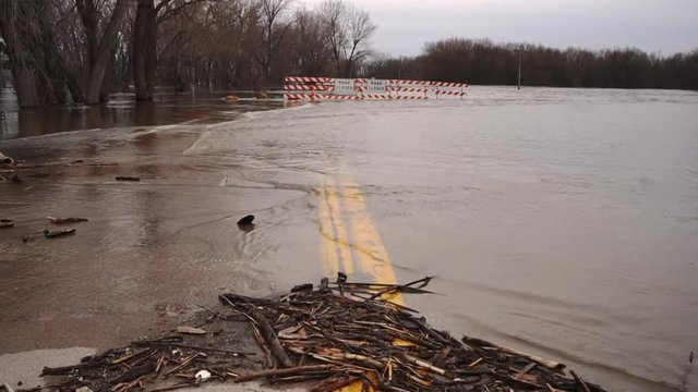 The Mississippi River Floods the Banks Breaching Levee Closing Roads