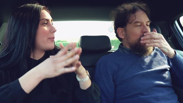 Woman fighting with boyfriend in car getting angry