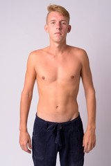 Fototapeta premium Portrait of young blonde man shirtless looking at camera