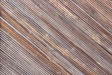 Wooden brown diagonal planks as background or texture