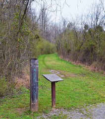 Trail and warning signs along the Shelby Bottoms Greenway and Natural Area Cumberland River frontage trails, Music City Nashville, Tennessee. United States.