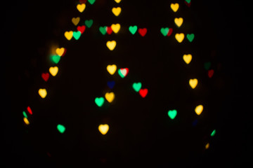 Colorful abstract heart shape blured bokeh at night