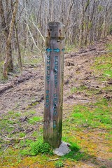 Trail and warning signs along the Shelby Bottoms Greenway and Natural Area Cumberland River frontage trails, Music City Nashville, Tennessee. United States.