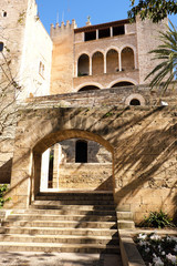 Fototapeta na wymiar Palma Mallorca almudaina kings palace side entrance garden arch vertical