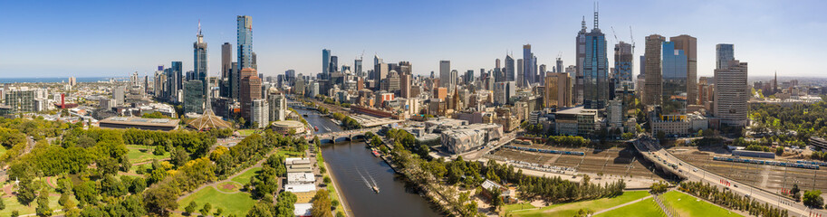 Naklejka na ściany i meble Panoramic view of the beautiful city of Melbourne as captured from above the Yarra river on a summer day
