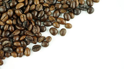 Many coffee beans on a white background with copy space for your text..