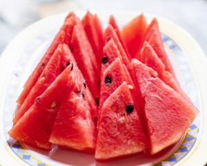 Tasty sliced watermelon in a dish.
