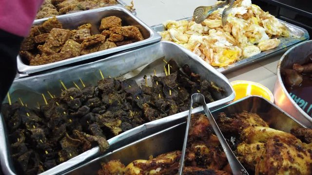 'Nasi lemak' (Malay fragrant rice) served with other dishes