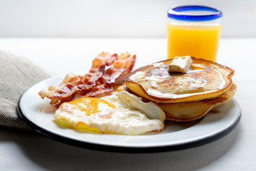 American breakfast with egg, pancake and bacon