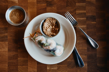 Shrimp salad roll with peanut dipping sauce and sweet chili sesame sauce.
