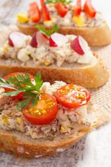Crusty baguette with mackerel or tuna fish paste, healthy nutrition