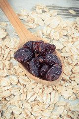 Oatmeal with dried cranberries as source carbohydrates, vitamins and dietary fiber, concept of healthy and nutritious eating