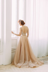 The bride in the interior Studio in the style of fine art. Wedding photo shoot in European style.