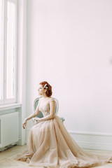 Fototapeta premium The bride in the interior Studio in the style of fine art. Wedding photo shoot in European style.
