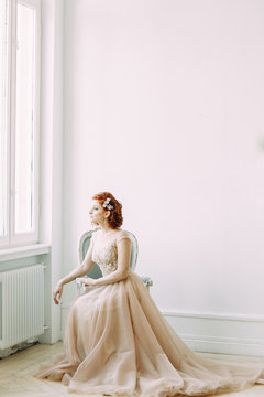 The bride in the interior Studio in the style of fine art. Wedding photo shoot in European style.
