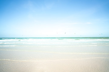 Blurred The sea and Kitesurf with blue sky. Summer holiday concept