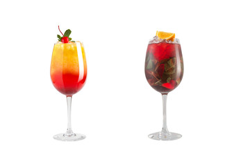 Alcohol cocktail with mint, fruit and berries on a white background. A set of two cocktails in glass goblets on a long leg.