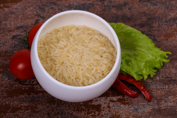 Raw uncooked rice in the bowl