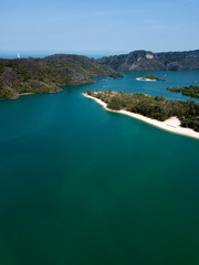 Aerial view of Kilim Geoforest Park. There is sea, river, coastline, mangroves and mountains on the photo. Langkawi, Malaysia.